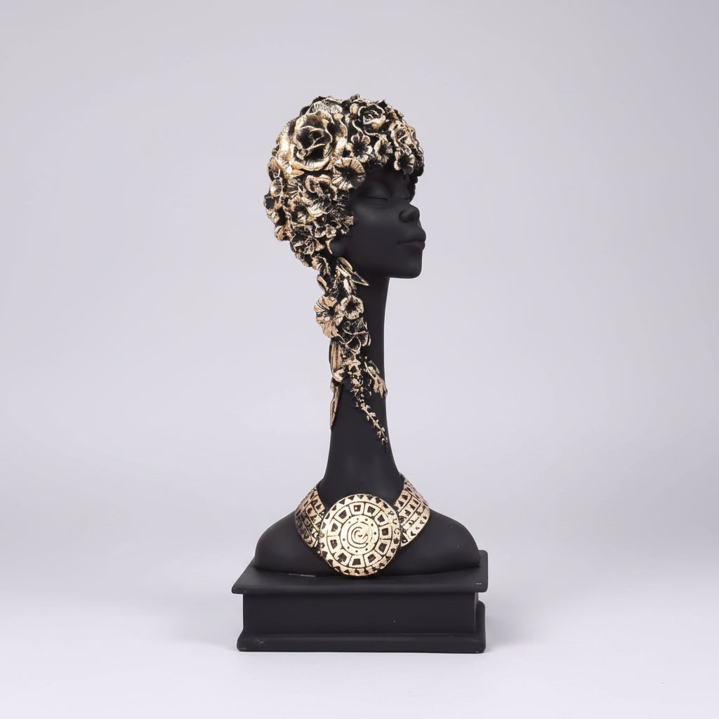 A handcrafted resin figurine of an African lady with detailed textures and decorative elements.