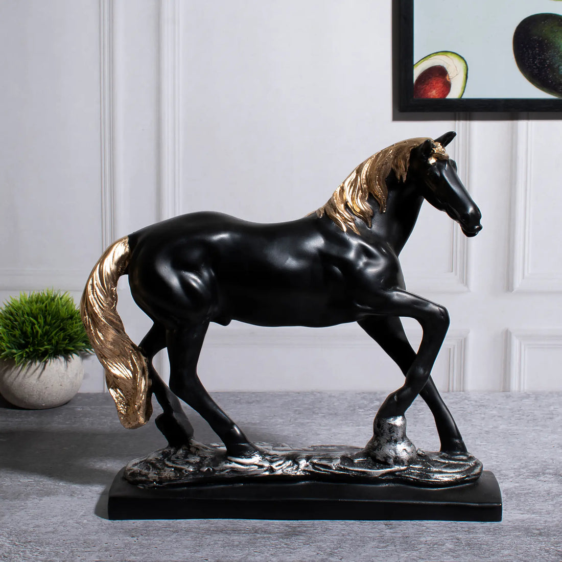 A Statue of a black running horse