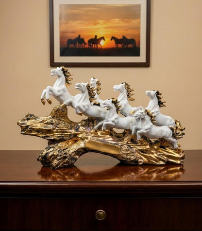 Aurance white and gold resin 7 running horses statue, a luxury Vastu decorative showpiece for home and office decor.