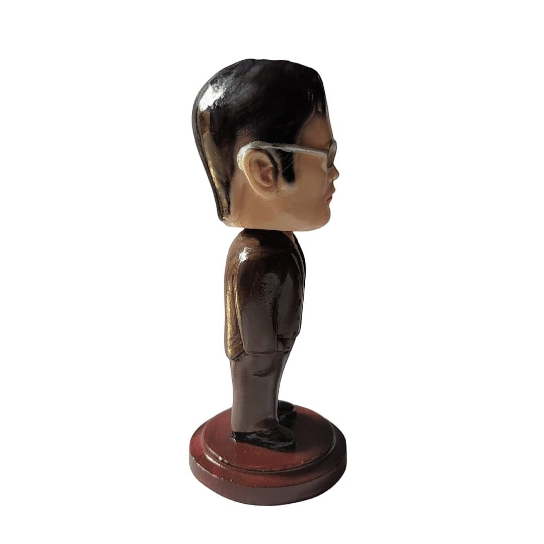 Aurance Dwight Schrute bobblehead figurine from The Office, side view showing brown suit and glasses on round base