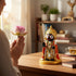 Aurance handcrafted resin Lord Jagannath statue with marble finish, displayed on a desk during a prayer session.