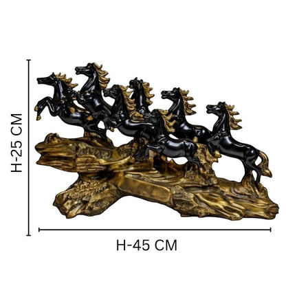 Aurance running horses tabletop sculpture with polished black horses on a textured antique gold base, 45cm wide.