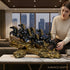 Aurance Running Horses tabletop sculpture with polished black horses on a textured antique gold base in a modern home.