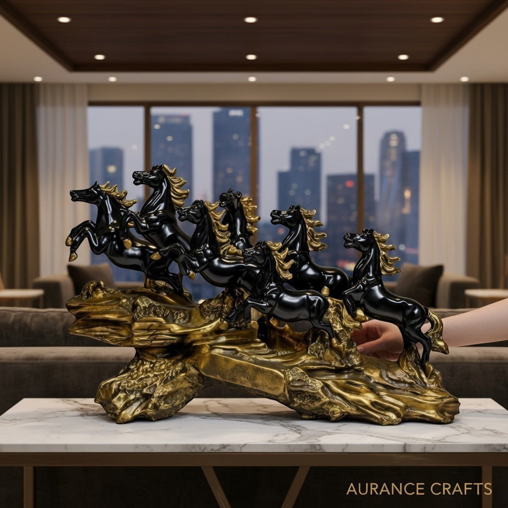 Aurance running horses tabletop sculpture with polished black horses on a textured antique gold base in a modern room.