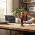 Aurance Sheldon Cooper resin bobblehead figurine wearing a Flash t-shirt on a wooden desk in a home office.